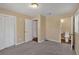 Bedroom with neutral walls, carpeted floor, window, and an attached bathroom, plus a closet at 3393 Ridgecrest Dr, Powder Springs, GA 30127