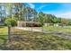 Property featuring a long driveway and lush greenery with a fenced in yard at 3393 Ridgecrest Dr, Powder Springs, GA 30127