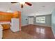 Open-concept view of kitchen and living room area, with stove, refrigerator, and TV mount at 3393 Ridgecrest Dr, Powder Springs, GA 30127