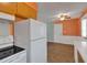 Kitchen with ample floor space, showing the cabinets, stove, refrigerator, and back door at 3393 Ridgecrest Dr, Powder Springs, GA 30127