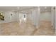 Open basement features a tile floor, support beams, and windows for natural light at 6050 Providence Ln, Cumming, GA 30040
