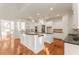 Elegant kitchen featuring double islands, white cabinets, and granite countertops at 6050 Providence Ln, Cumming, GA 30040