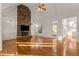 Open living space with vaulted ceilings, stone fireplace, and natural light at 6050 Providence Ln, Cumming, GA 30040