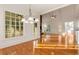 Bright living room featuring a stone fireplace, high ceilings, and large windows at 6050 Providence Ln, Cumming, GA 30040