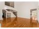 Bright living room with staircase, hardwood floors and access to kitchen at 6050 Providence Ln, Cumming, GA 30040