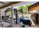 Inviting back patio area with a hot tub, comfortable seating, and shade at 7001 Palomino Trl, Winston, GA 30187