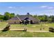 The sprawling backyard includes well-manicured lawn, and a fenced-in area at 7001 Palomino Trl, Winston, GA 30187