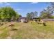 A spacious backyard featuring a shed, deck, gazebo, and a partially fenced in yard at 7001 Palomino Trl, Winston, GA 30187