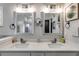 Bathroom with dual sinks, granite countertop, and modern fixtures, adjacent to shower room and main bedroom at 7001 Palomino Trl, Winston, GA 30187
