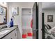 The bathroom features a white vanity with gray counters and tile flooring at 7001 Palomino Trl, Winston, GA 30187