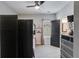 Cozy bedroom with ceiling fan, gray carpet, and dark wood closet and door at 7001 Palomino Trl, Winston, GA 30187