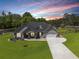 Beautiful twilight image of a single Gathering home with an expansive lawn at 7001 Palomino Trl, Winston, GA 30187