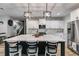 Modern kitchen with white cabinets, stainless steel appliances, and spacious island at 7001 Palomino Trl, Winston, GA 30187