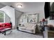 Comfortable living room with a television, a white sofa, and a red sofa at 7001 Palomino Trl, Winston, GA 30187