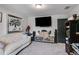 Comfortable living room has a large screen tv and a decorative art piece at 7001 Palomino Trl, Winston, GA 30187