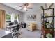 Home office space with desk, chair, computer, and a large window offering natural light at 7001 Palomino Trl, Winston, GA 30187