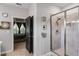 Modern shower with glass door, gray tile walls, and brushed chrome hardware, adjacent to the main bedroom at 7001 Palomino Trl, Winston, GA 30187