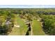 A sprawling golf course surrounded by lush trees at 11815 Mountain Laurel Dr, Roswell, GA 30075