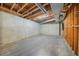 Unfinished basement featuring exposed pipes and wood studs, ready for your personal touch at 11815 Mountain Laurel Dr, Roswell, GA 30075