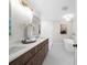 Elegant bathroom featuring a double vanity, soaking tub, and modern fixtures at 11815 Mountain Laurel Dr, Roswell, GA 30075