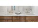 Bathroom vanity with double sinks, quartz countertops, and wooden cabinets at 11815 Mountain Laurel Dr, Roswell, GA 30075