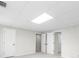 Spacious bedroom with large ceiling light, closet doors, and neutral wall color at 11815 Mountain Laurel Dr, Roswell, GA 30075