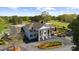A beautiful view of the clubhouse featuring a welcoming entryway, golf course, and flagpole at 11815 Mountain Laurel Dr, Roswell, GA 30075
