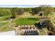 Aerial shot of the golf course practice area featuring a putting green and golf carts at 11815 Mountain Laurel Dr, Roswell, GA 30075