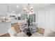 Bright eat-in kitchen with dining table and stainless steel appliances at 11815 Mountain Laurel Dr, Roswell, GA 30075