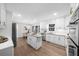 Bright eat-in kitchen with stainless steel appliances, marble countertops, and white cabinetry at 11815 Mountain Laurel Dr, Roswell, GA 30075
