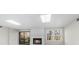 Cozy living room with a fireplace, window, and sliding glass door for natural light at 11815 Mountain Laurel Dr, Roswell, GA 30075