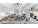 Living room boasts a fireplace, built-in shelving, ceiling fan, and sophisticated decor at 11815 Mountain Laurel Dr, Roswell, GA 30075