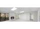 Open living area with fireplace, window, sliding glass door, and access to additional rooms at 11815 Mountain Laurel Dr, Roswell, GA 30075