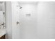 Modern shower with white subway tile and gold fixtures at 11815 Mountain Laurel Dr, Roswell, GA 30075