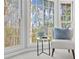Bright sitting area with large windows offering a view of the surrounding trees at 11815 Mountain Laurel Dr, Roswell, GA 30075