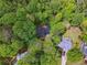 Aerial view of neighborhood surrounded by mature trees at 3988 Dover Ave, Alpharetta, GA 30009