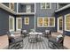 Exterior view of the backyard patio with outdoor seating, ideal for entertaining and enjoying the outdoors at 3988 Dover Ave, Alpharetta, GA 30009