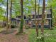 Charming home featuring a backyard, a wooden deck and lush landscaping at 3988 Dover Ave, Alpharetta, GA 30009