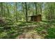 Wood shed on a wooded lot with mature trees at 3988 Dover Ave, Alpharetta, GA 30009