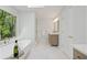 Spa-like bathroom features a soaking tub, a glass-enclosed shower, and a large window with wooded views at 3988 Dover Ave, Alpharetta, GA 30009