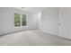 Bright bedroom featuring natural light, neutral carpet, and fresh, white paint at 3988 Dover Ave, Alpharetta, GA 30009
