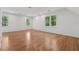 Large bonus room with multiple windows and hardwood floors, perfect for flexible living at 3988 Dover Ave, Alpharetta, GA 30009