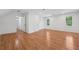 Spacious bonus room with multiple windows and hardwood floors for a versatile living space at 3988 Dover Ave, Alpharetta, GA 30009