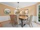 Charming dining room featuring a wood table, six chairs, and modern light fixture at 3988 Dover Ave, Alpharetta, GA 30009