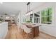Dining space featuring a wooden table, four chairs, and a view of the backyard at 3988 Dover Ave, Alpharetta, GA 30009