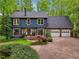 Charming two-story home with stone accents and a well-manicured lawn at 3988 Dover Ave, Alpharetta, GA 30009
