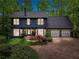 Charming two-story home with stone accents and a well-manicured lawn at 3988 Dover Ave, Alpharetta, GA 30009