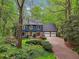 Charming two-story home with a stone accents, a two-car garage, and mature landscaping at 3988 Dover Ave, Alpharetta, GA 30009