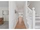 Inviting foyer with hardwood floors, staircase, and detailed trim, offering a welcoming entrance at 3988 Dover Ave, Alpharetta, GA 30009