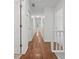 Bright hallway features hardwood floors and classic white doors with stylish hardware at 3988 Dover Ave, Alpharetta, GA 30009